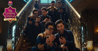 a group of men taking a picture on their cell phones