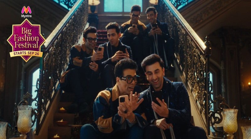 a group of men taking a picture on their cell phones