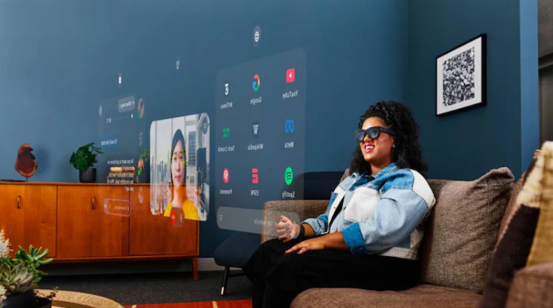 A person wearing augmented reality glasses sits on a couch, interacting with virtual screens displaying various apps in a modern living room.